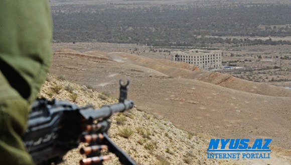 Silahlılar Suriyada yaşayış məntəqələrini atəşə tutublar